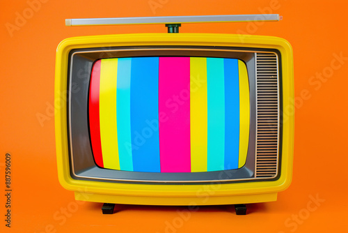 a yellow television with colorful stripes