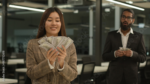 Unequal salary inequality wage discrimination Asian woman rich business girl businesswoman hold big money banknotes female office envy jealousy Indian businessman man male guy shock little finance