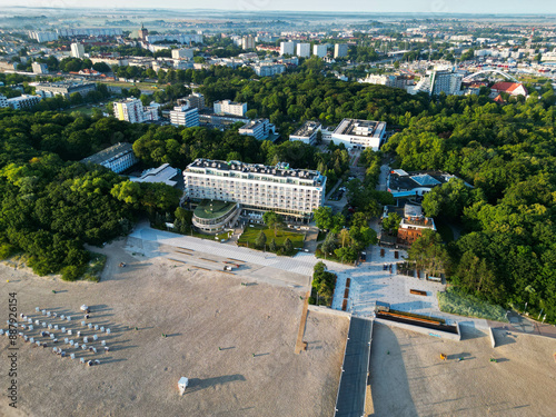 The photo showcases the charming town of Kołobrzeg, located on the shores of the Baltic Sea. Kołobrzeg is a popular resort known for its beautiful beaches, historical landmarks, and numerous tourist a