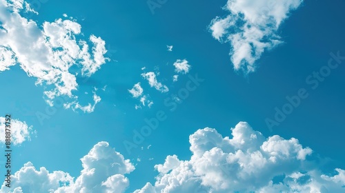 White fluffy clouds against a bright blue sky