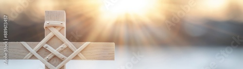 Wooden cross with sunlight streaming in background, symbolizing faith, hope, and spirituality. Perfect for religious and inspirational themes.