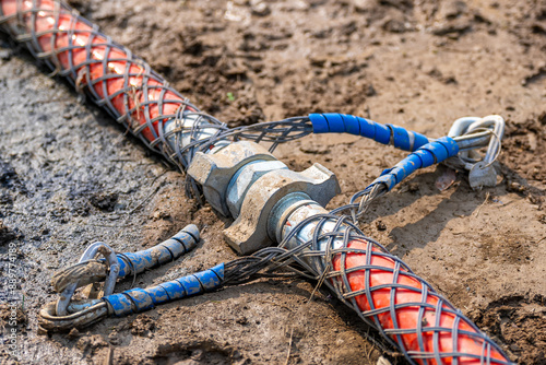 High air pressure hose fitting connection with safety whip, restraint, check cables. 