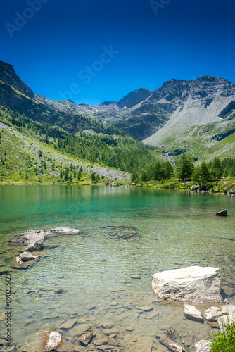 Morgex, Italy, 10 July 2022: The beautiful crystal clear water of the Arpy Lake in Aosta Valley