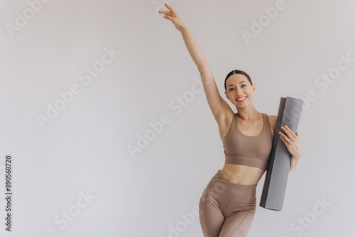 Young woman holding yoga mat isolated on white background, panoramic banner, Sport, fitness, meditation, yoga balance, mindfulness, workout, hobby, healthy lifestyle concept