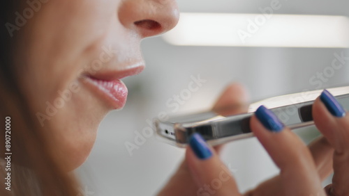 Woman mouth talking smartphone speaker closeup. Girl recording voice message