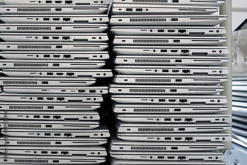 Big stacks of discarded laptops, notebooks on a trolley