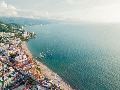 Sunset on the Mexican Coast of the Pacific Ocean, Los Muertos Beach and Tourist Pier. Puerto Vallarta, Jalisco