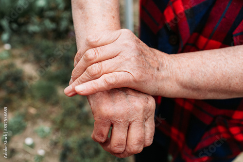 Elderly woman showing her hands joints