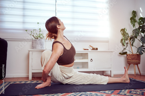 caucasian woman practicing yoga, wellness at home 