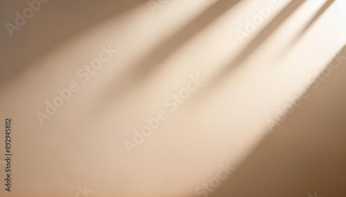 Light beige background for product presentation with a light and shadows pattern on it