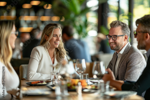 business lunch at a high-end restaurant with executives discussing deals