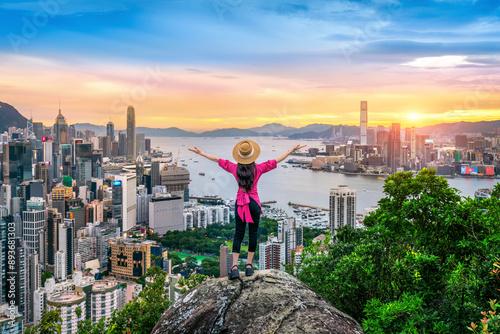 Tourist standing on viewpoint in Hong Kong.