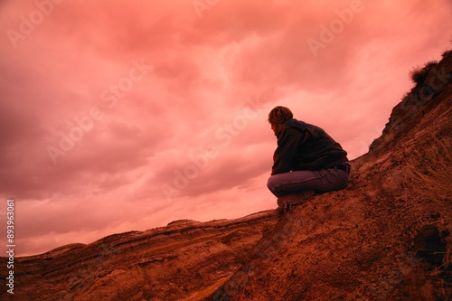 Man Sitting On Hill