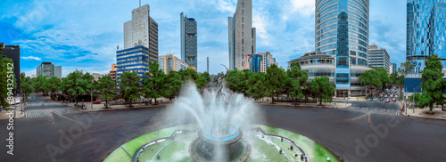 defaultPanoramic Aerial View of the Iconic Diana the Huntress Roundabout on a Clear Day in Mexico City, Showcasing the Harmony of the Sculptural Fountain with Minimal Traffic on Reforma Avenue.