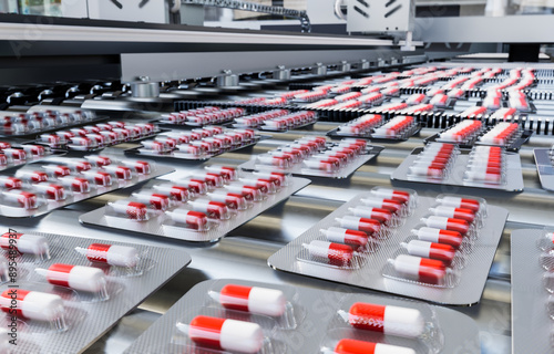 Capsules in blister pack on production line in pharmaceutical industry