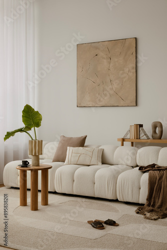 Cosy and stylish interior design of living room with modular white sofa, wooden furnitures, paintings on the wall, decorations, windowsill and personal accessories. Home styling. Template.