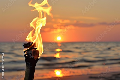 Flaming Torch at Sunset on the Beach, a vibrant scene of a glowing torch illuminating the shoreline, against a backdrop of colorful sunset hues reflecting on the water.