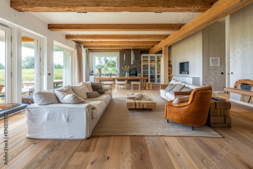 Luxury living room with wooden walls, hardwood floor and comfortable sofa. Northwest, USA