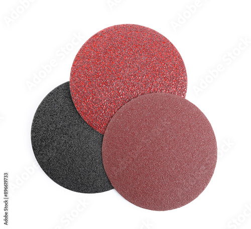 Coarse sandpaper disks isolated on white, top view