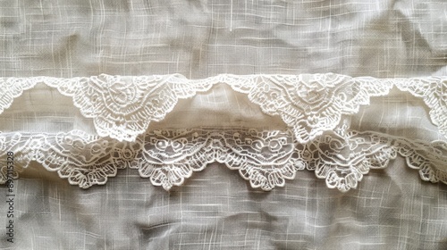 The white lace ribbon pops against the linen fabric set against a bright background