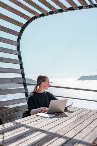 Work,Remotely work.freelancer works remotely home.cozy workation, remote work,leisure, work life balance,digital nomad, workation,work travel,remotely work.Travelling.Work vacation remotely