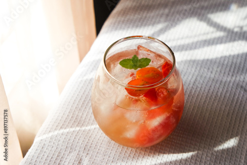 Tomato ade is a common drink in cafe consist of tomato with soda and garnished with mint.