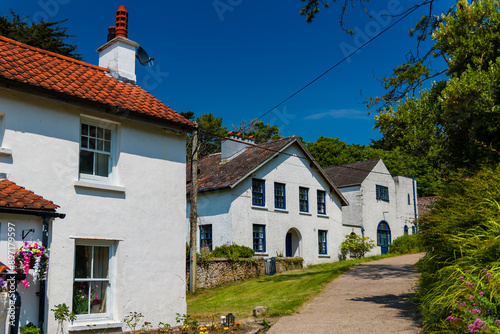 Colourful ancient houses on the main street of Caldey Island, Wales