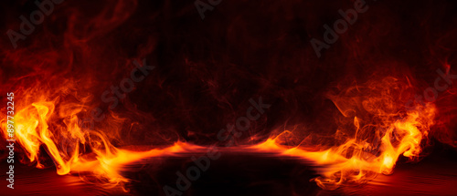 Dramatic fire and smoke effect glowing red and yellow colors exploding outwards with center space. Vivid and hot hell abstract or blazing fire background or wallpaper