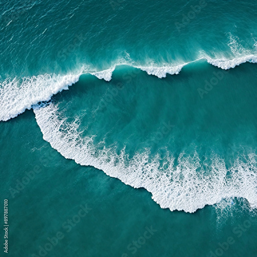 Aerial view beautiful of sea waves from drone. Stock image of blue color of ocean water, sea surface. Top view on turquoise waves, clear water surface texture.