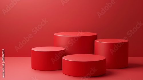 Four red cylindrical podiums on a red background. Minimalist design for product display or presentation.