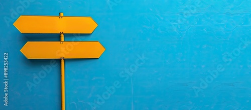 Close up comparison background featuring two blank signs on a blue backdrop providing copy space for your text and functioning as direction signs