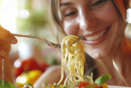 joyful pasta moment closeup of smiling young woman savoring forkful of colorful pasta warm natural lighting fresh ingredients in background focus on genuine emotion and culinary delight