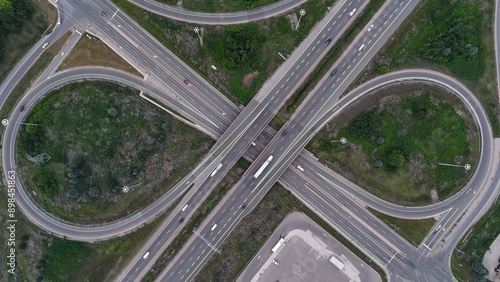 Aerial view of a highway interchange with looping roads and green spaces in Cambridge, Canada