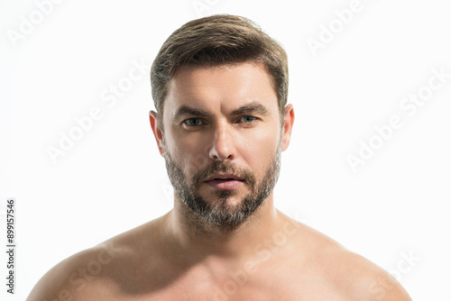 Close up portrait of half naked man 40s . Handsome serious middle aged man with fresh perfect smooth skin. Portrait of a beautiful man with perfect faces skin. Face care, male cosmetics.