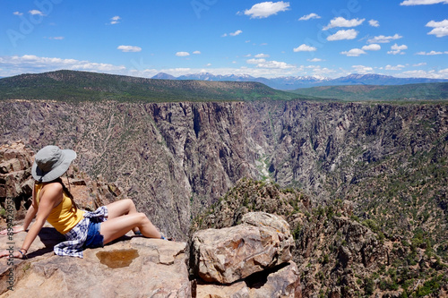 A young white female overlooking the Black Canyon of the Gunnison