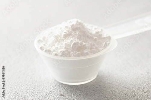 Powdered magnesium oxide or sulfate in a medicine spoon, water soluble drug group