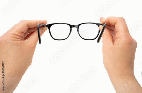 Woman holding eyeglasses, first person pov shot, isolated white background