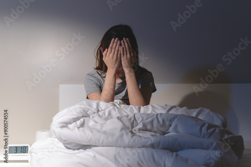 Anxiety disorder on insomnia woman concept, sleepless Woman open eye awakening on the bed at night time can't sleep from symptom of depression diseased.