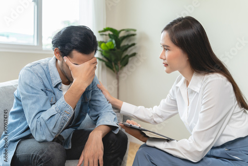 mental health issues concept, doctor touching patient hand showing empathy during depression therapy session.