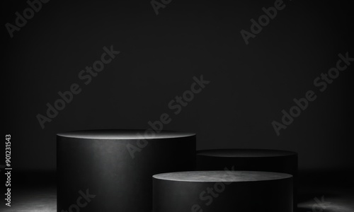 Three black cylindrical podiums on a black background