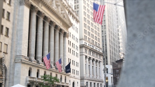 New York City, United States. Lower Manhattan Downtown Financial District urban architecture exterior. American flag. Wall street Stock Exchange building facade columns, USA Stock Market trading, NYC.