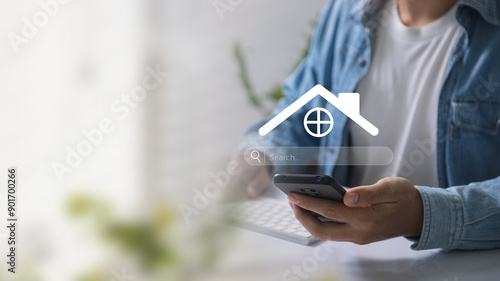 A person uses a smartphone to search for real estate online, highlighting digital home search technology. Discover Property Listings, Market Trends, and Investment for Effective Real Estate Management