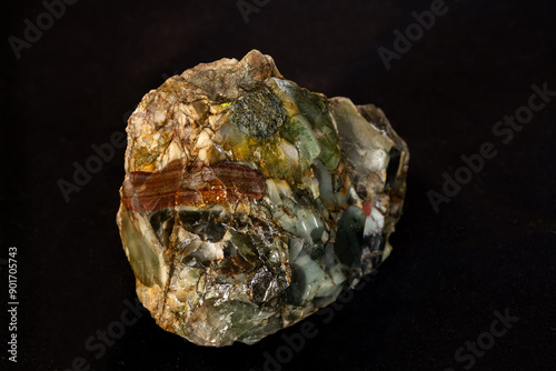 A chert conglomerate from the Fig Tree Formation of the Barberton greenstone belt against a black background