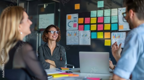 A marketing team discussing the effectiveness of subway ads in a meeting.