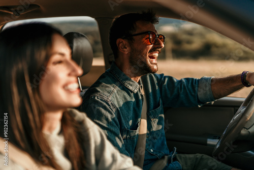 Young couple enjoying the freedom on a Car Trip over a country offroad