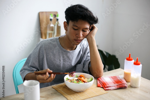 Asian Man Having No Appetite To Eat