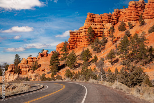 Utah Hwy 12 curves through Red Rock Canyon, near Bryce NP, Utah. The rocks are eroded into the familiar pinnacles, spires, columns and hoodoos.