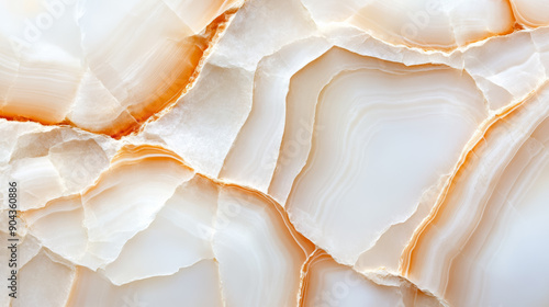 Closeup of alabaster stone with a smooth, almost translucent white surface and faint natural lines 