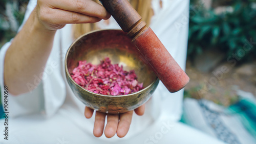 woman holding a tibetan singing bowl