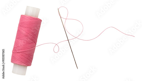 Old spool of thread and needle on a white background. Sewing accessories